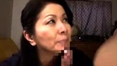 Asian mature slut giving a blowjob